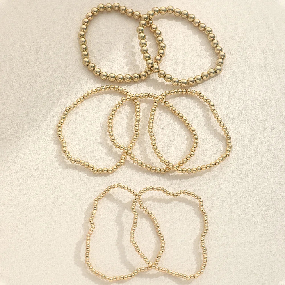 Bold Sphere Stack Bracelet – Gold Beaded Elegance